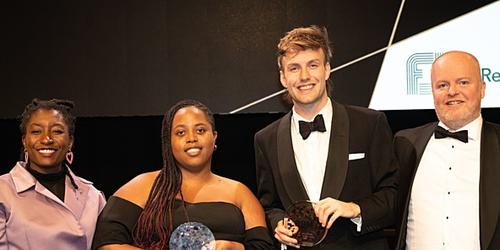 LaShanda Seaman and Joshua Proctor collecting their awards for Young Researcher of the Year - Agency - on stage at the MRS Awards 2023.